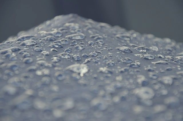 Rain beading on tent Rain beading on a waterproofed tent