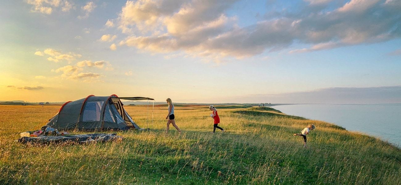 Pop up tent by lake