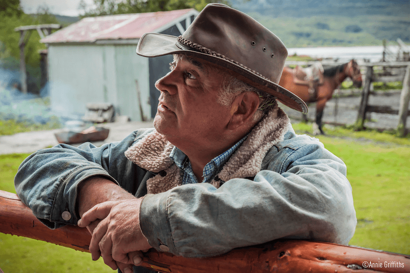 Man resting on a wooden fence, taken with Panasonic S1R