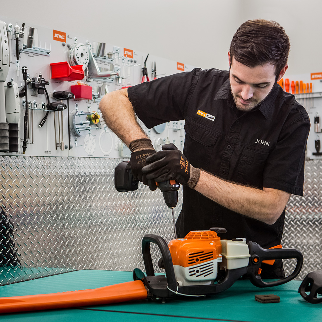 A STIHL SHOP technician servicing a STIHL Hedgetrimmer