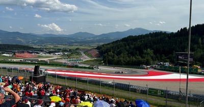 Fans on Grandstand T3 on the Red Bull Ring watching the drivers take on corner 3