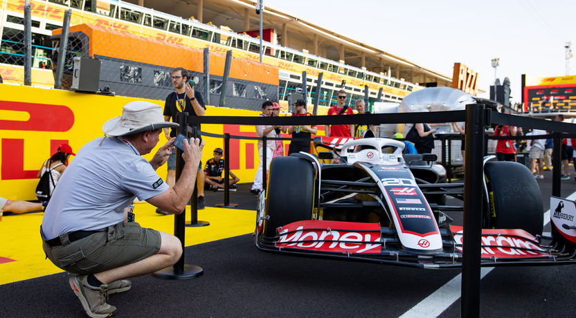 A Haas F1 car on display in the pit lane