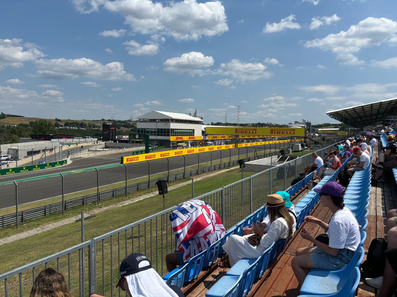 Fans on a grandstand of Hungaroring that gives a view of the exit of pit lane