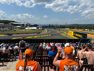 Fans on the Red Bull Grandstand on Hungaroring watching the F1 cars drive by