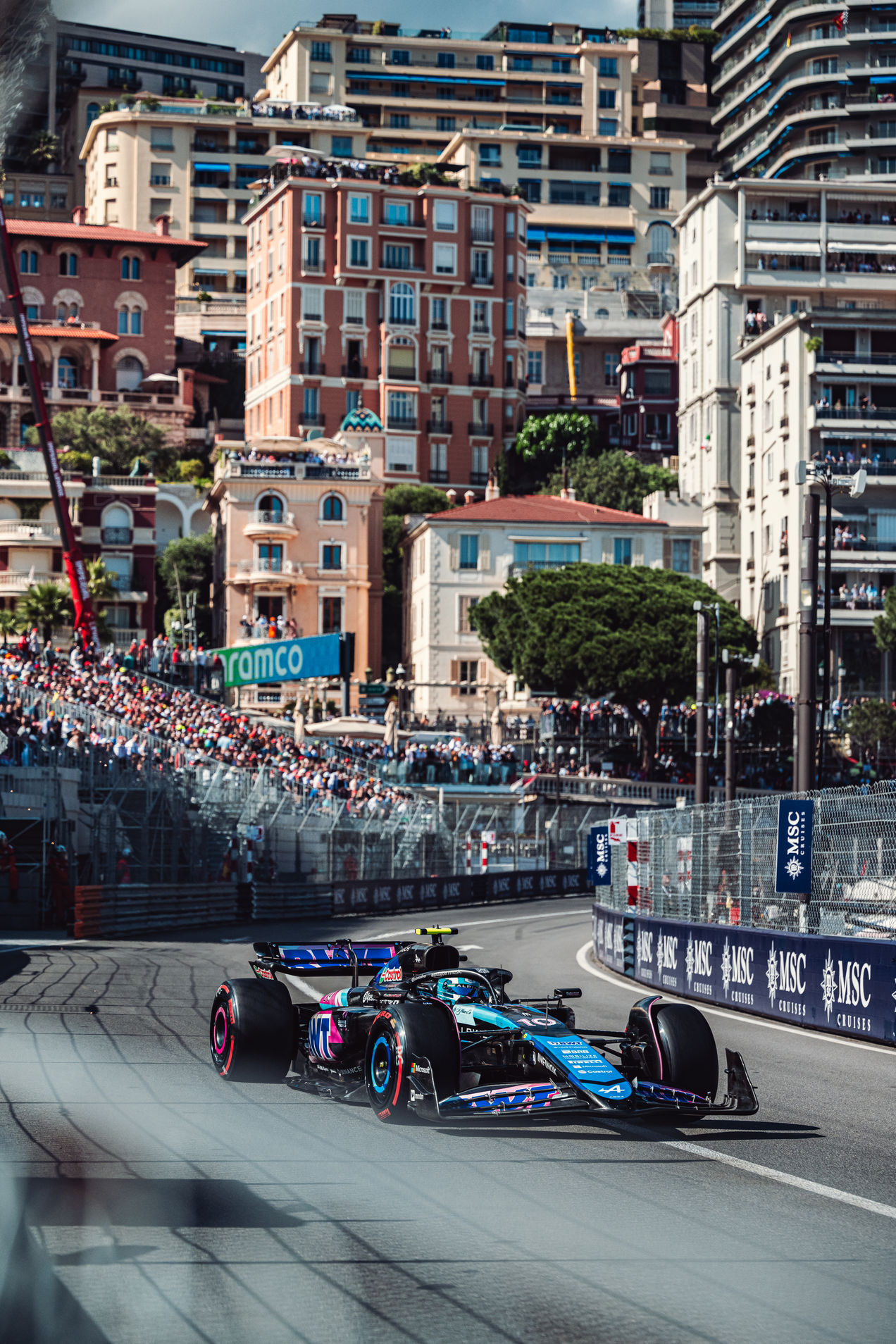 BWT Alpine F1 car driving through the streets of Monaco
