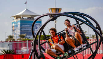 Two men on a rollercoaster ride on Yas Island at the Abu Dhabi Grand Prix