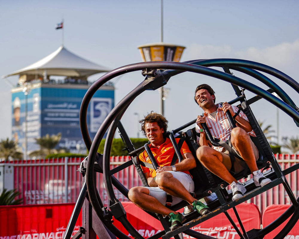 Two men on a rollercoaster ride on Yas Island at the Abu Dhabi Grand Prix