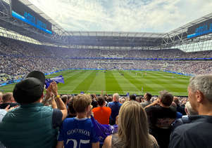Everton fans watching a match from the stands at Goodison Park