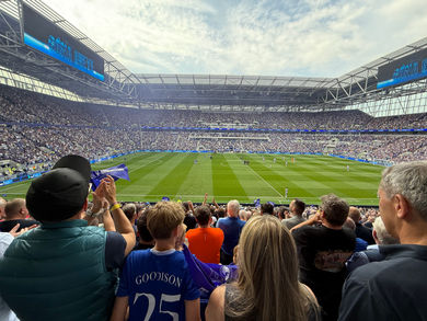 Everton fans watching a match from the stands at Goodison Park