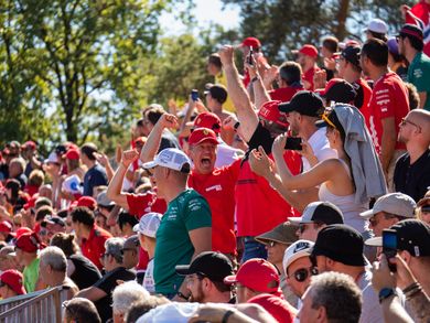 Formula 1 fans cheering in the stands at the Monza Grand Prix
