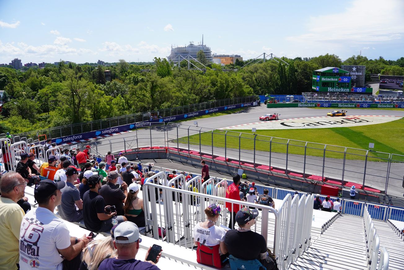 Cars racing by Grandstand 31 at the Canadian GP