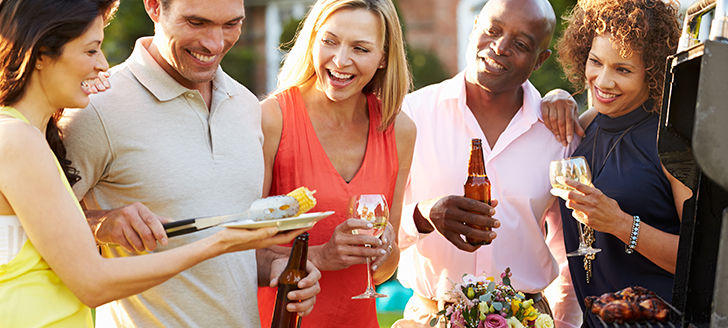 Group of friends socializing over a BBQ