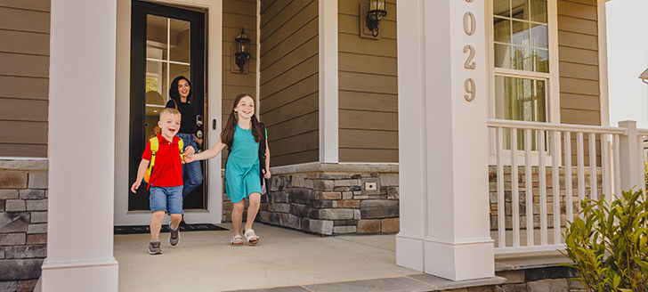 Kids and mom walking out of the front door