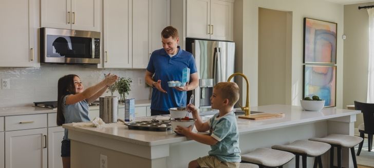 family cooking in a kitchen