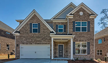 Street view of The Arline All Brick Single-Family Home