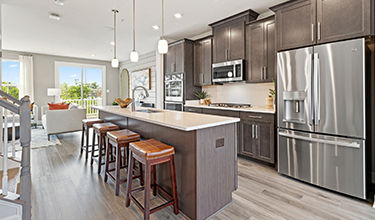 gourmet kitchen with island the louisa at the woodlands