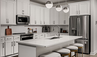 Design Collection Signature A includes: Tahoe Painted Linen Kitchen Cabinets, Carrara Marmi Quartz Counter Tops, Kohler Finishes, GE Appliances, Visionary Taupe Laminate