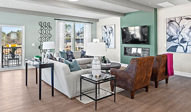 family room with fireplace and beams