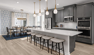 Design Collection Signature B includes: Tahoe Painted Linen Kitchen Cabinets, Carrara Morro Quartz Counter Tops, Kohler Finishes, GE Appliances, New Moon Laminate