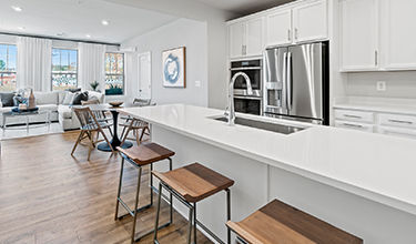 Design Collection Inspired B includes: Barnett Duraform Linen Kitchen Cabinets, Frost White Quartz Counter Tops, Kohler Finishes, GE Appliances, Chesapeake Newport Laminate