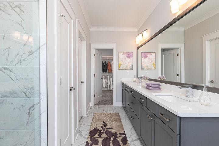 dual cabinet vanity and tile shower