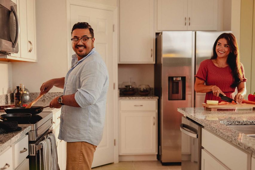 Couple Cooking in the Kitchen at Avalon Park Tavares