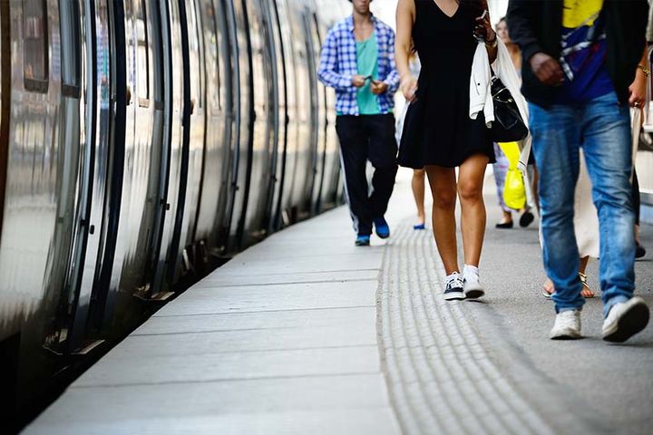 outdoor metro station with train approaching