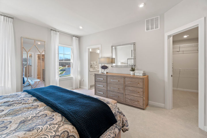 primary bedroom with closet and ensuite bath