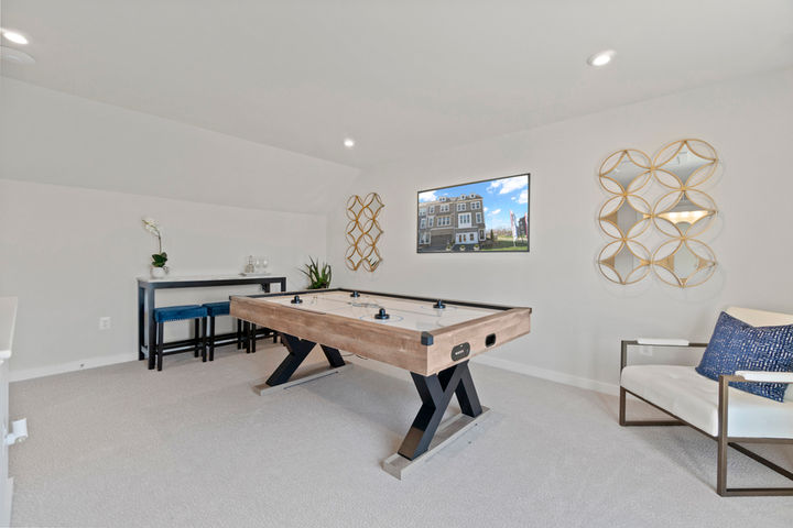 Loft level staged as a game room