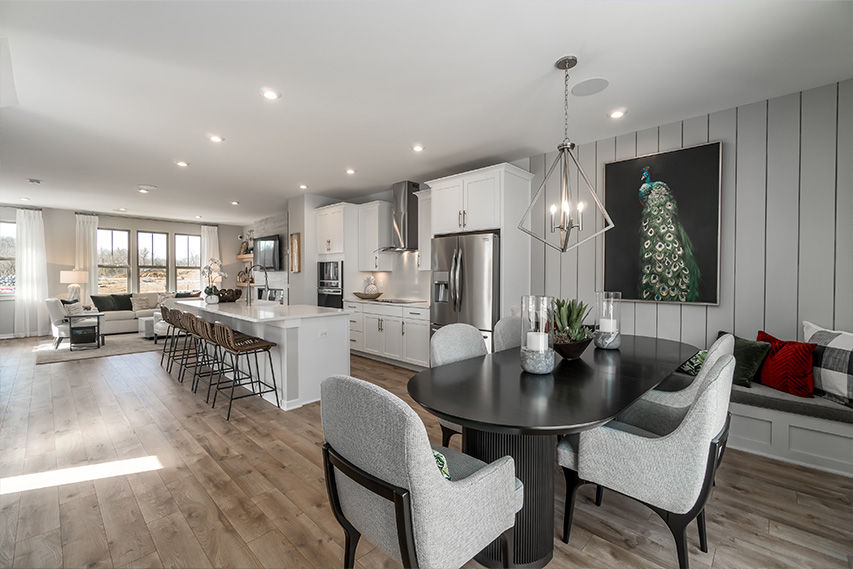 open concept main level floorplan with kitchen in center