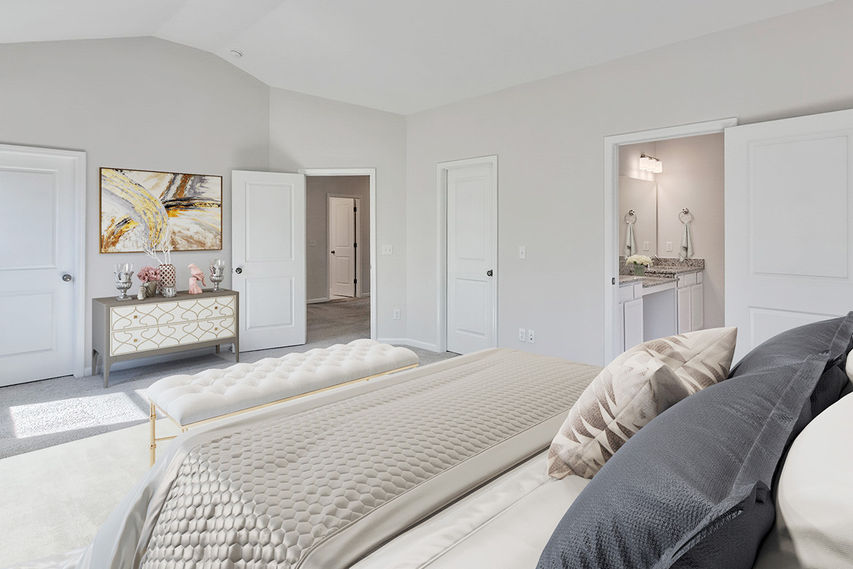 Owner's bedroom in The Arline with vaulted ceiling