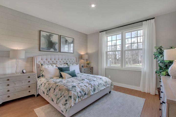 primary bedroom with bright windows