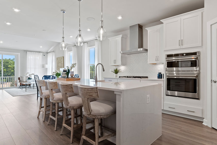 open concept main level with fireplace in family room