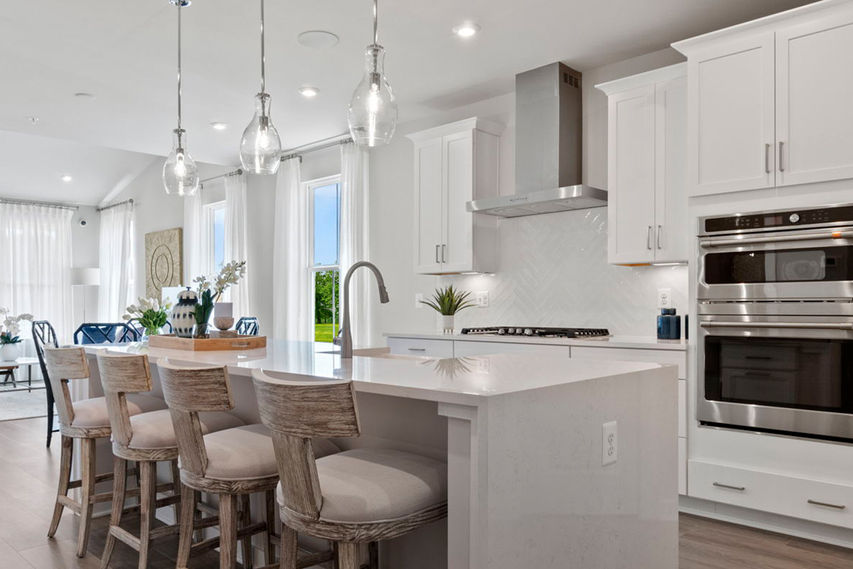 open concept main level with fireplace in family room