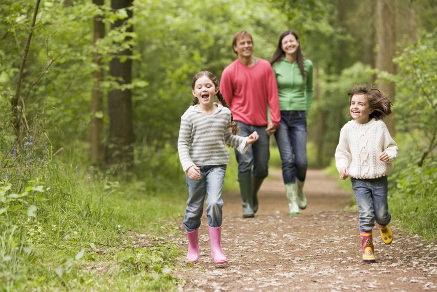 Family walk in the woods outdoors