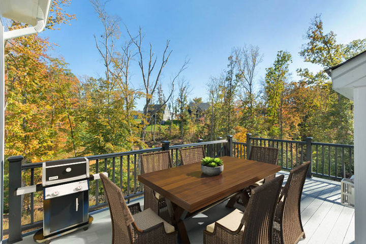 rear deck overlooking wooded backyard