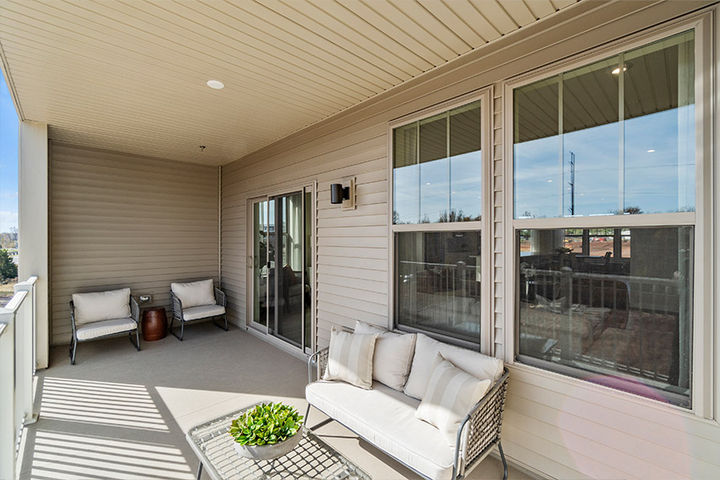 covered rear balcony with sliding door