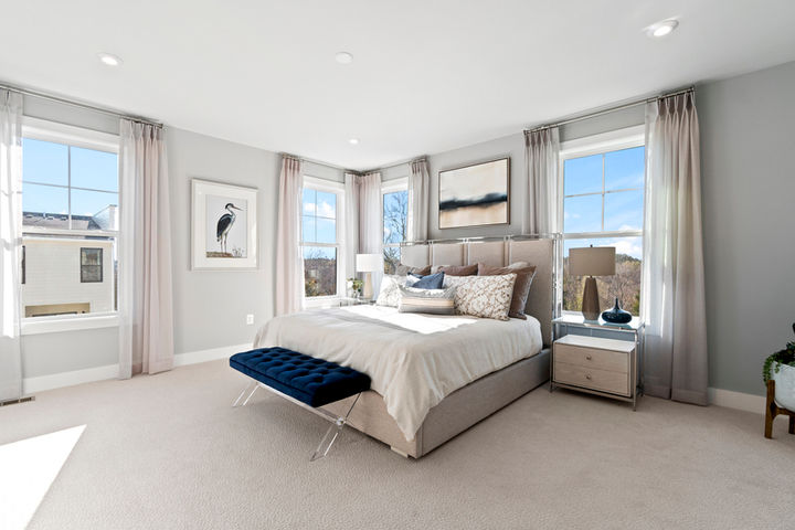 primary bedroom with bright windows