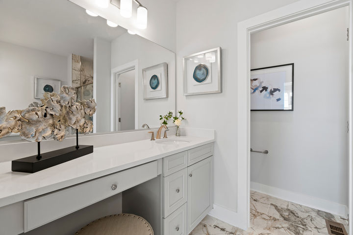 primary bath with cabinet vanity