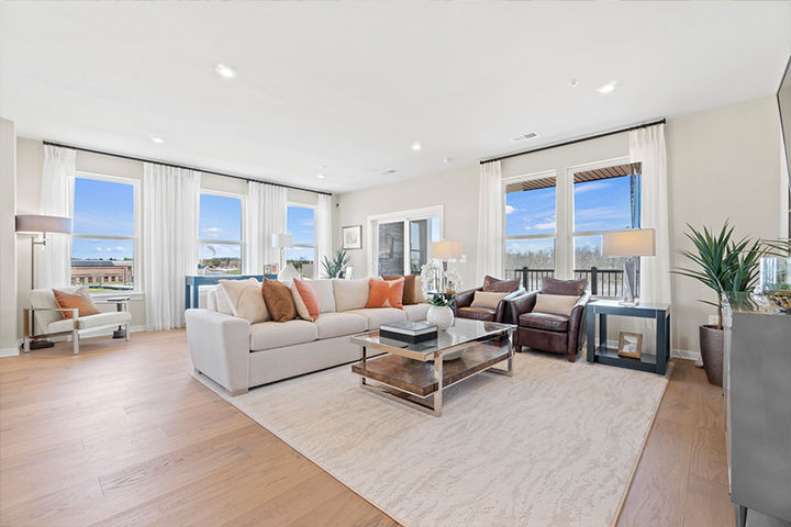 family room with conversational seating and bright windows