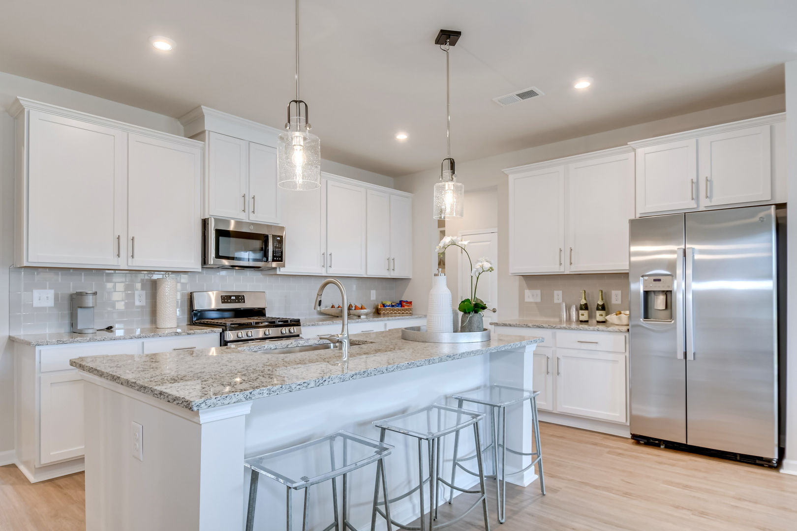 Kitchens with Large Islands and Designer Inspired Finishes at Hickory Woods