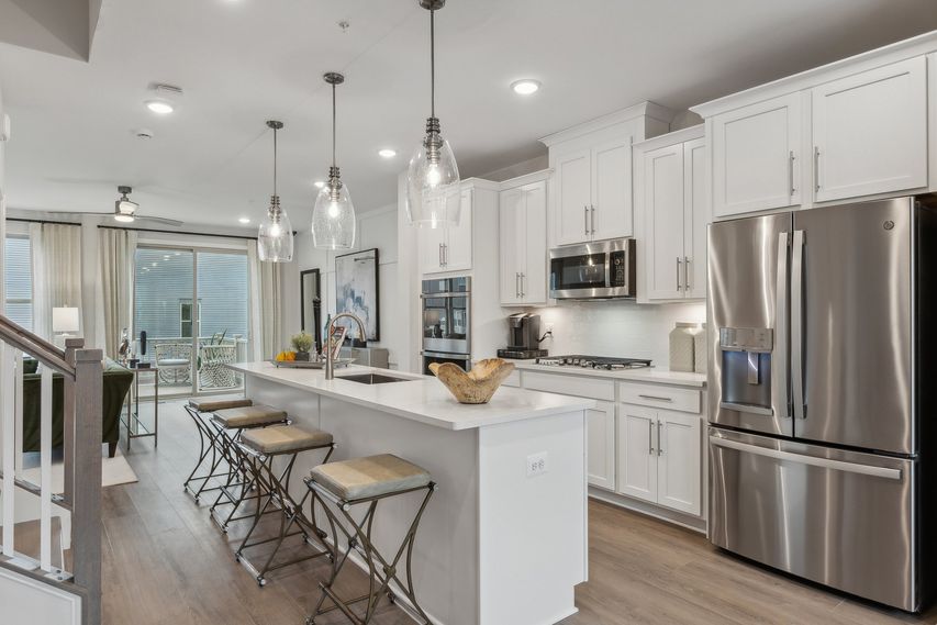 Gourmet kitchen, end unit, and oak stairs 