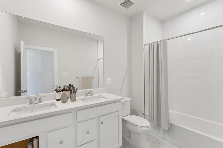 Upper Level Guest Bathroom with Dual Sinks, available on select homesites