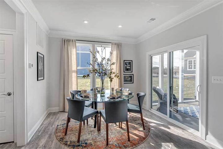 dining area next to sliding door to patio