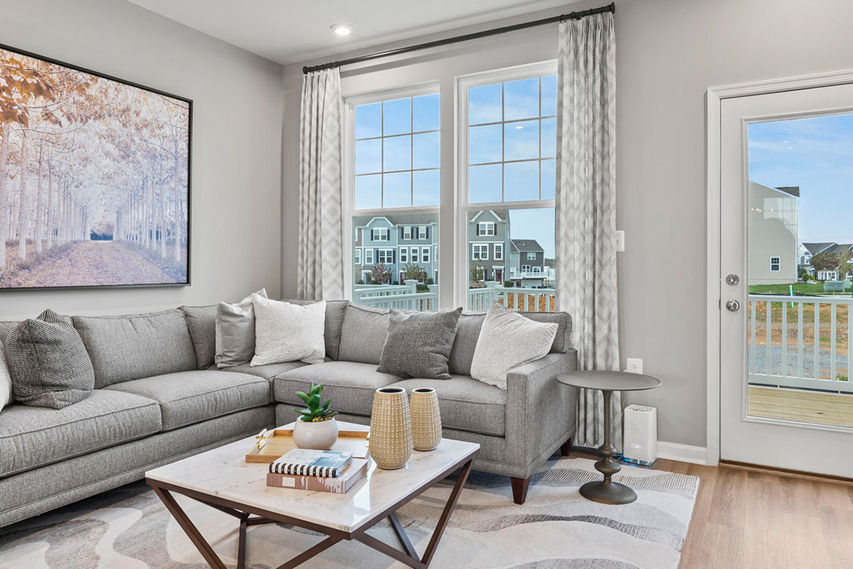 family room for entertainment with large sectional couch and bright windows