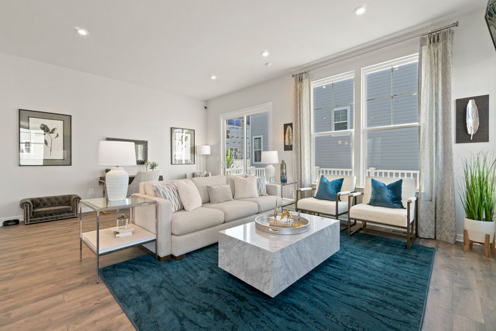 family room with large sofa and chairs in front of fireplace