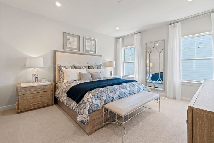 primary bedroom with bright windows