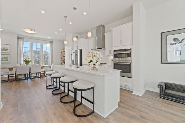 gourmet kitchen open to dining room