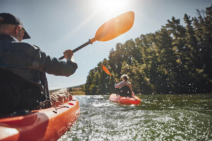 couple kayaking on river