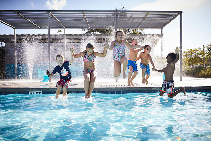 kids jumping in pool at potomac shores